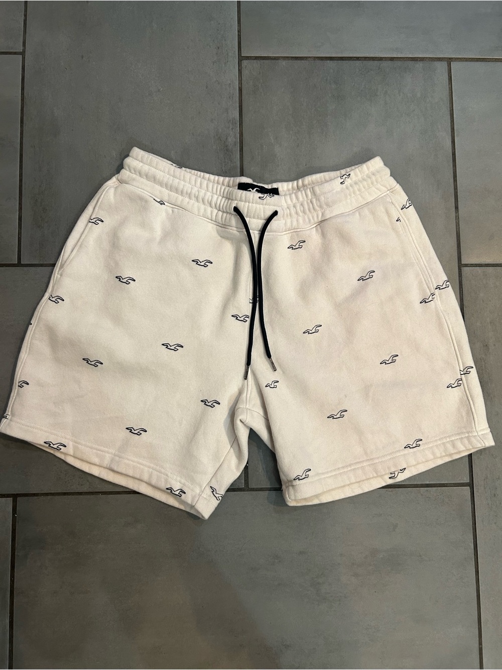 Hollister “Logo-All-Over” Shorts in White